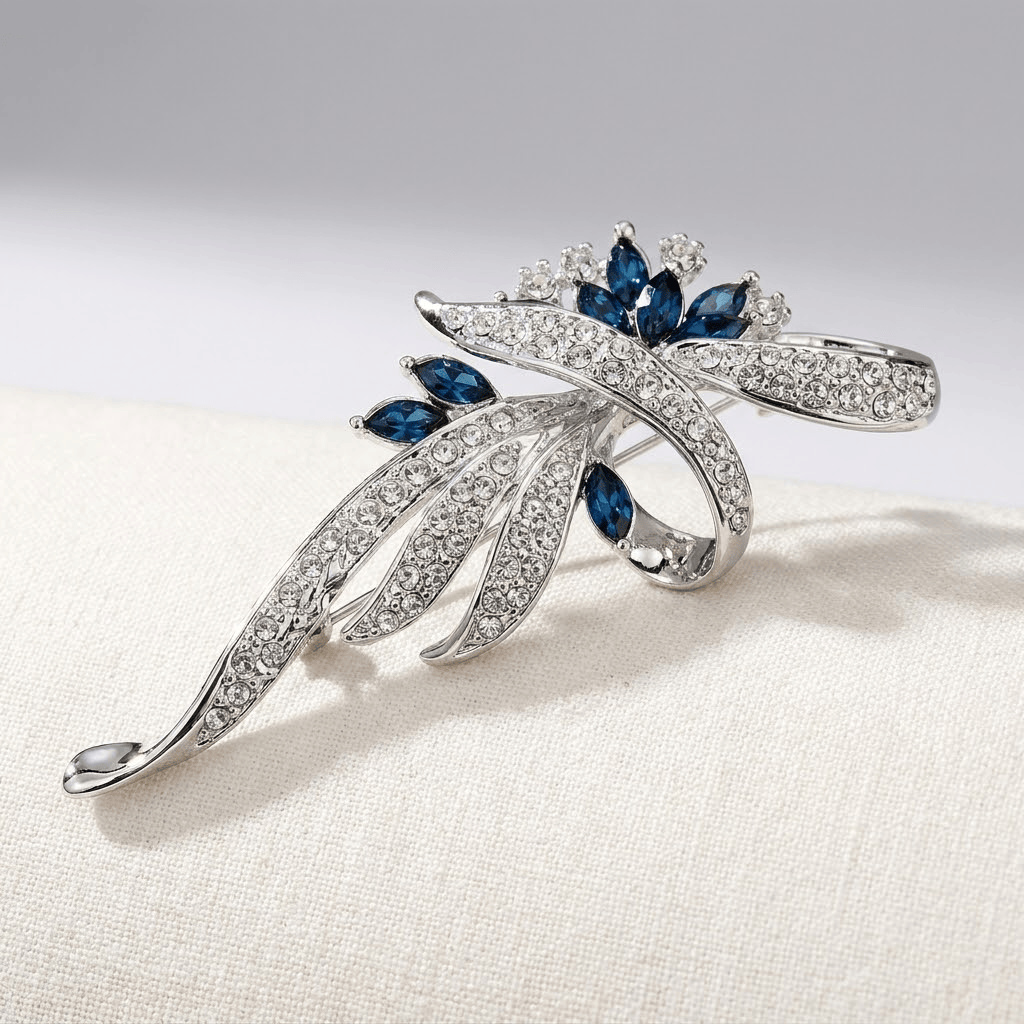 Elegant Sapphire Swirl Brooch